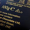 Písmeno "K" v trojúhelníku je logem Kosher certifikace
